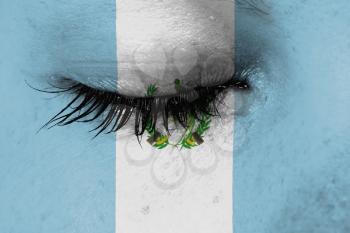 Crying woman, pain and grief concept, flag of Guatemala