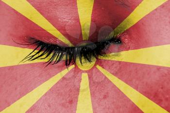 Crying woman, pain and grief concept, flag of Macedonia