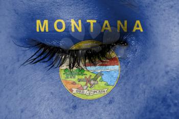 Crying woman, pain and grief concept, flag of Montana