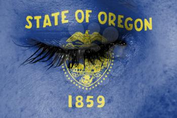 Crying woman, pain and grief concept, flag of Oregon