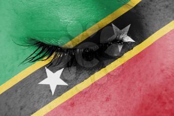 Crying woman, pain and grief concept, flag of Saint Kitts and Nevis