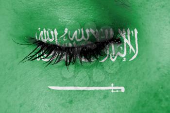 Crying woman, pain and grief concept, flag of Saudi Arabia