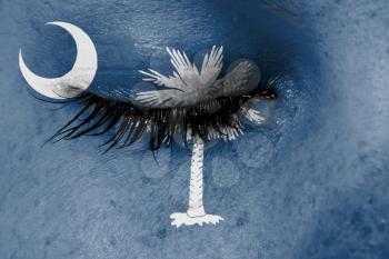 Crying woman, pain and grief concept, flag of South Carolina