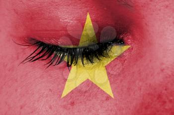 Crying woman, pain and grief concept, flag of Vietnam