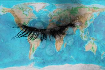 Women eye, close-up, concept of sadness, world map
