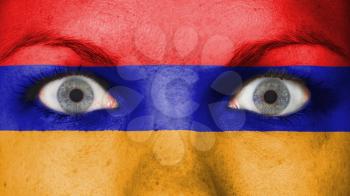 Close up of eyes. Painted face with flag of Armenia