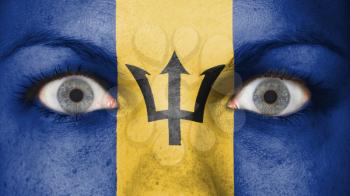 Close up of eyes. Painted face with flag of Barbados