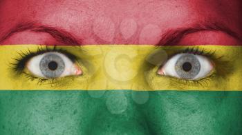 Close up of eyes. Painted face with flag of Bolivia