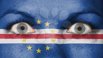Close up of eyes. Painted face with flag of Cape Verde