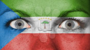 Close up of eyes. Painted face with flag of Equatorial Guinea