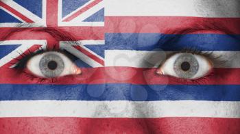 Close up of eyes. Painted face with flag of Hawaii