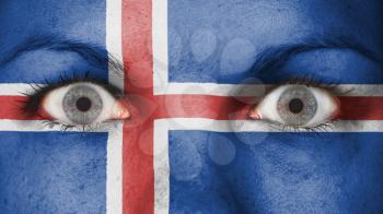 Close up of eyes. Painted face with flag of Iceland