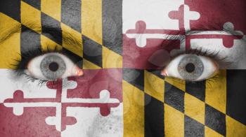 Close up of eyes. Painted face with flag of Maryland