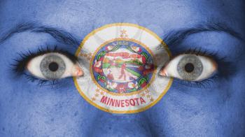Close up of eyes. Painted face with flag of Minnesota