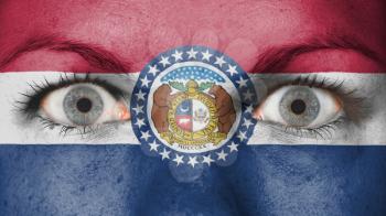 Close up of eyes. Painted face with flag of Missouri