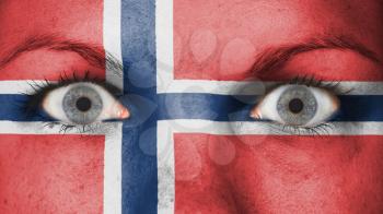 Close up of eyes. Painted face with flag of Norway