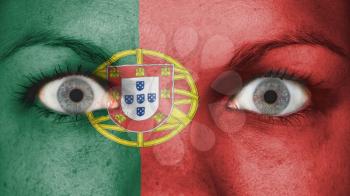 Close up of eyes. Painted face with flag of Portugal