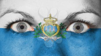 Close up of eyes. Painted face with flag of San Marino