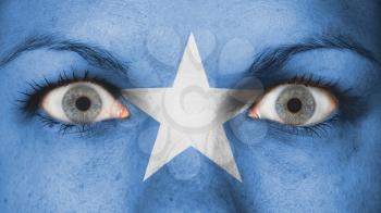Close up of eyes. Painted face with flag of Somalia