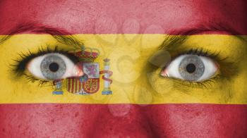 Close up of eyes. Painted face with flag of Spain