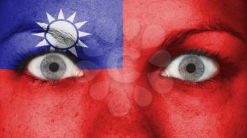 Close up of eyes. Painted face with flag of Taiwan