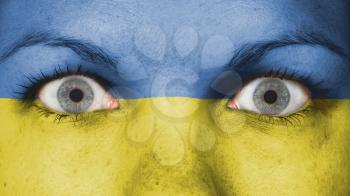 Close up of eyes. Painted face with flag of Ukraine