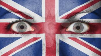 Close up of eyes. Painted face with flag of United Kingdom