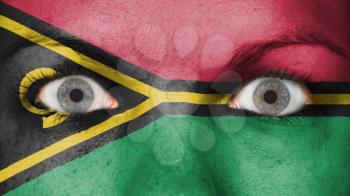 Close up of eyes. Painted face with flag of Vanuatu