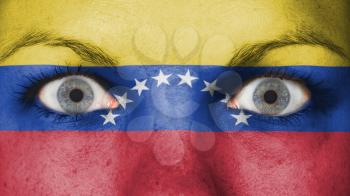Close up of eyes. Painted face with flag of Venezuela