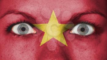Close up of eyes. Painted face with flag of Vietnam