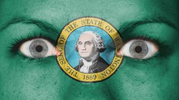 Close up of eyes. Painted face with flag of Washington