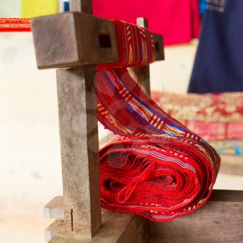 Handmade silk textile industry, silk scarf on a old machine (Vietnam)