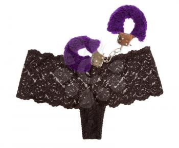 Fluffy purple handcuffs and panties on a white background, prostitution