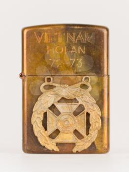 Very old lighter from the Vietnam war on a white background