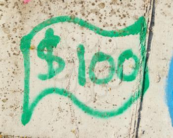 Simple green dollar bill (graffity) on a concrete wall