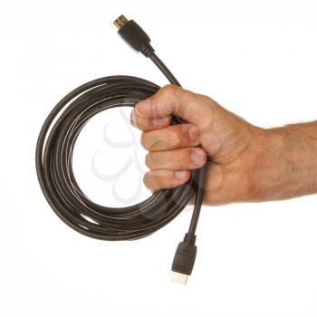 Close-up of hdmi cable in a hand on white background