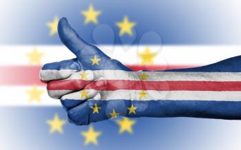 Old woman giving the thumbs up sign, isolated, flag of Cape Verde