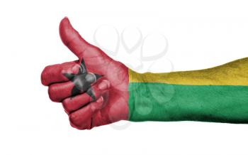 Old woman giving the thumbs up sign, isolated, flag of Guinea-Bissau
