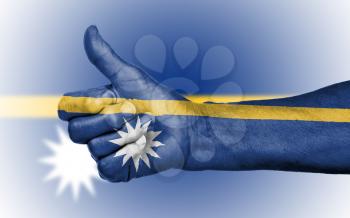Old woman giving the thumbs up sign, isolated, flag of Nauru