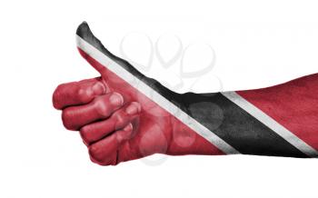 Old woman giving the thumbs up sign, isolated, flag of Trinidad and Tobago