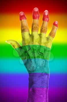 Old hand high with a rainbow flag pattern