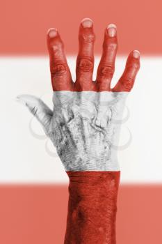 Isolated old hand with flag, European Union, Austria