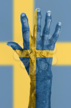 Isolated old hand with flag, European Union, Sweden