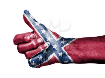 Old woman with arthritis giving the thumbs up sign, isolated on white, Confederate flag