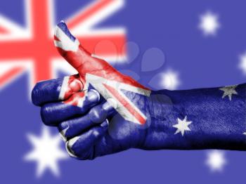 Australian flag on thumbs up hand isolated on a flag background
