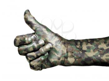 Old woman with arthritis giving the thumbs up sign, isolated on white, camouflage