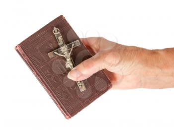 Old hand (woman) holding a very old bible, isolated on white