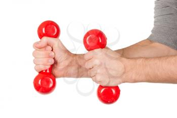 Red dumbbells in the hands of a man, isolated on white