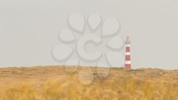 Red and white lighthouse on the dutch isle of Ameland, Holland