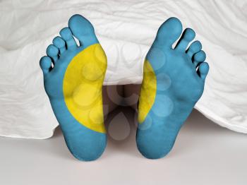 Feet with flag, sleeping or death concept, flag of Palau